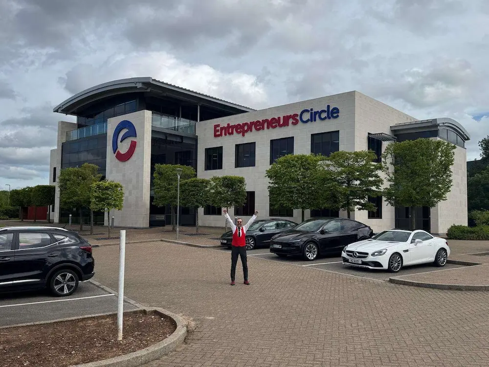 Man stood in car park outside entrepreneurs circle HQ building Man stood in car park outside entrepreneurs circle HQ building